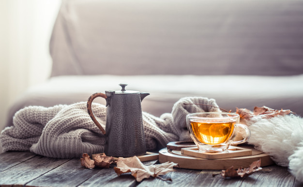 Cozy autumn still life with a cup of tea Free Photo