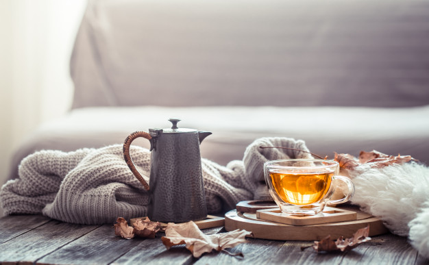 Cozy autumn still life with a cup of tea Free Photo