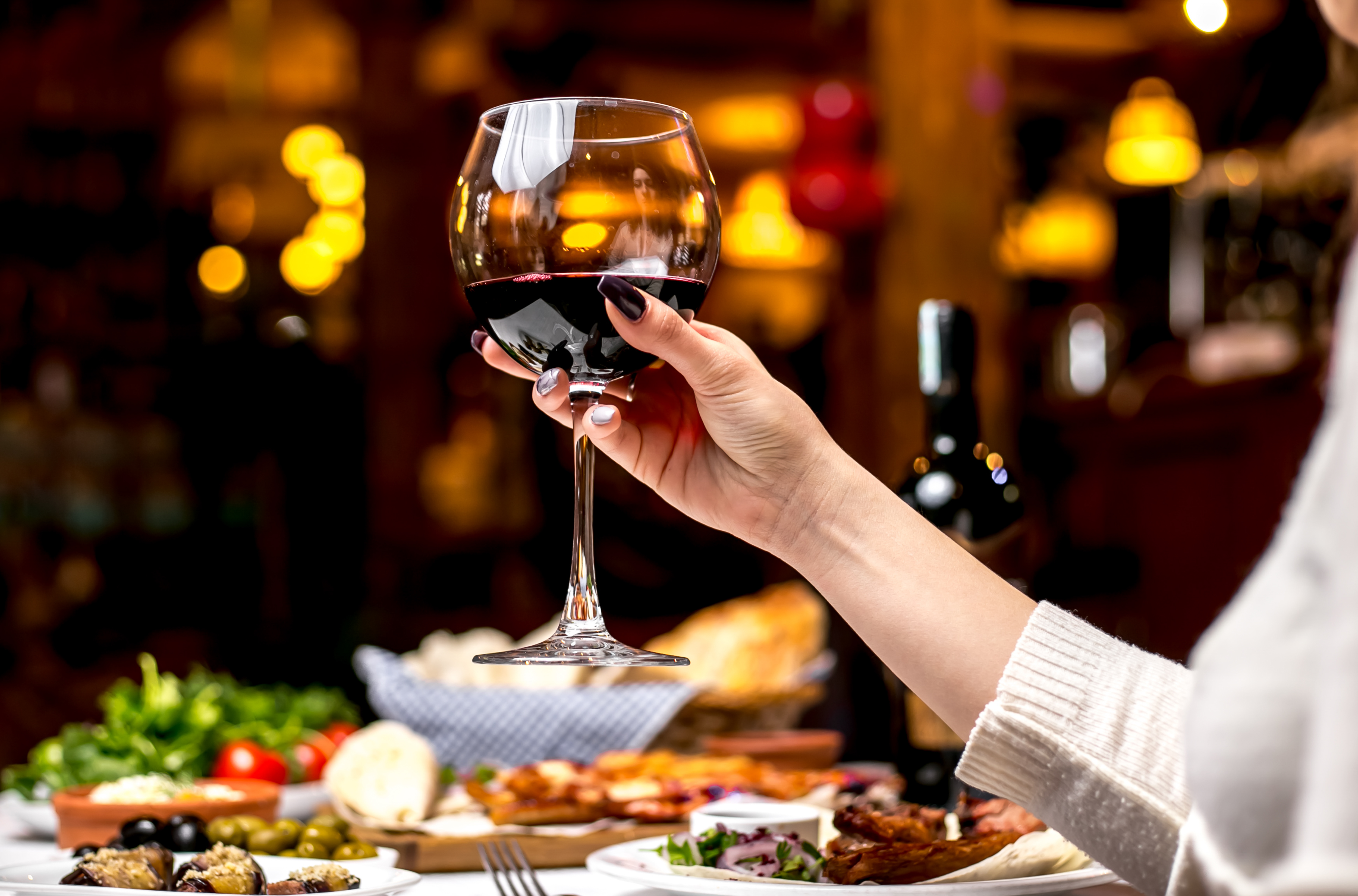 side-view-woman-drinks-glass-red-wine.jpg