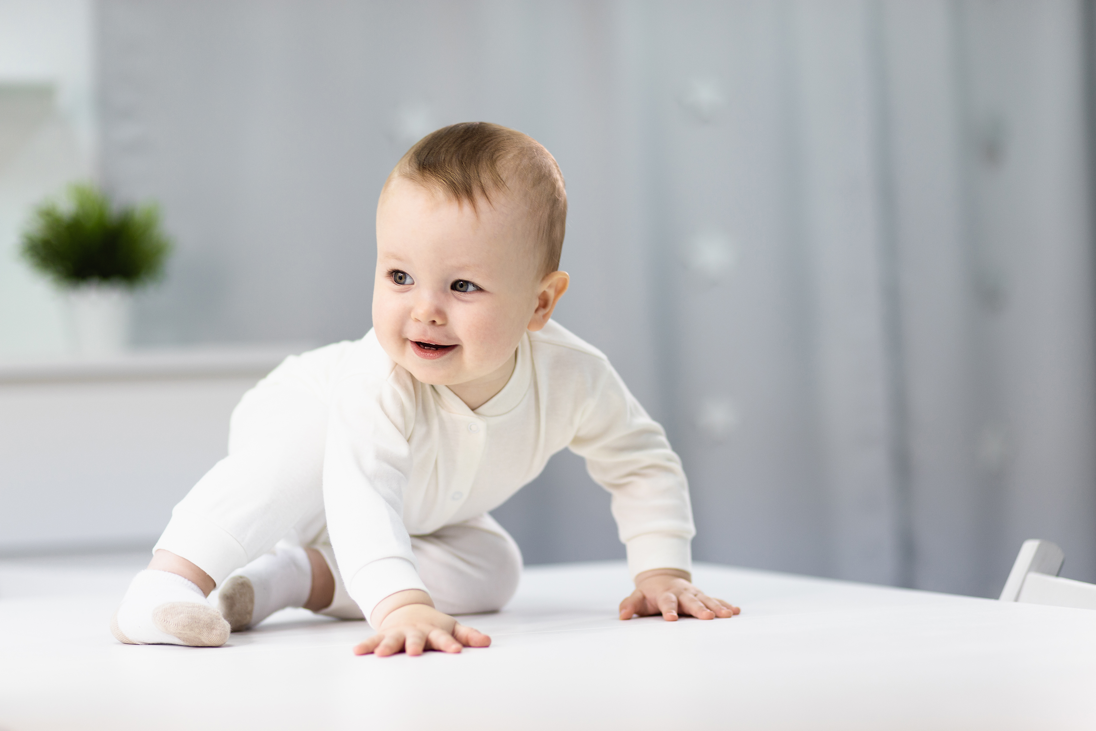 naked-baby-white-suit-sitting-bright-room.jpg